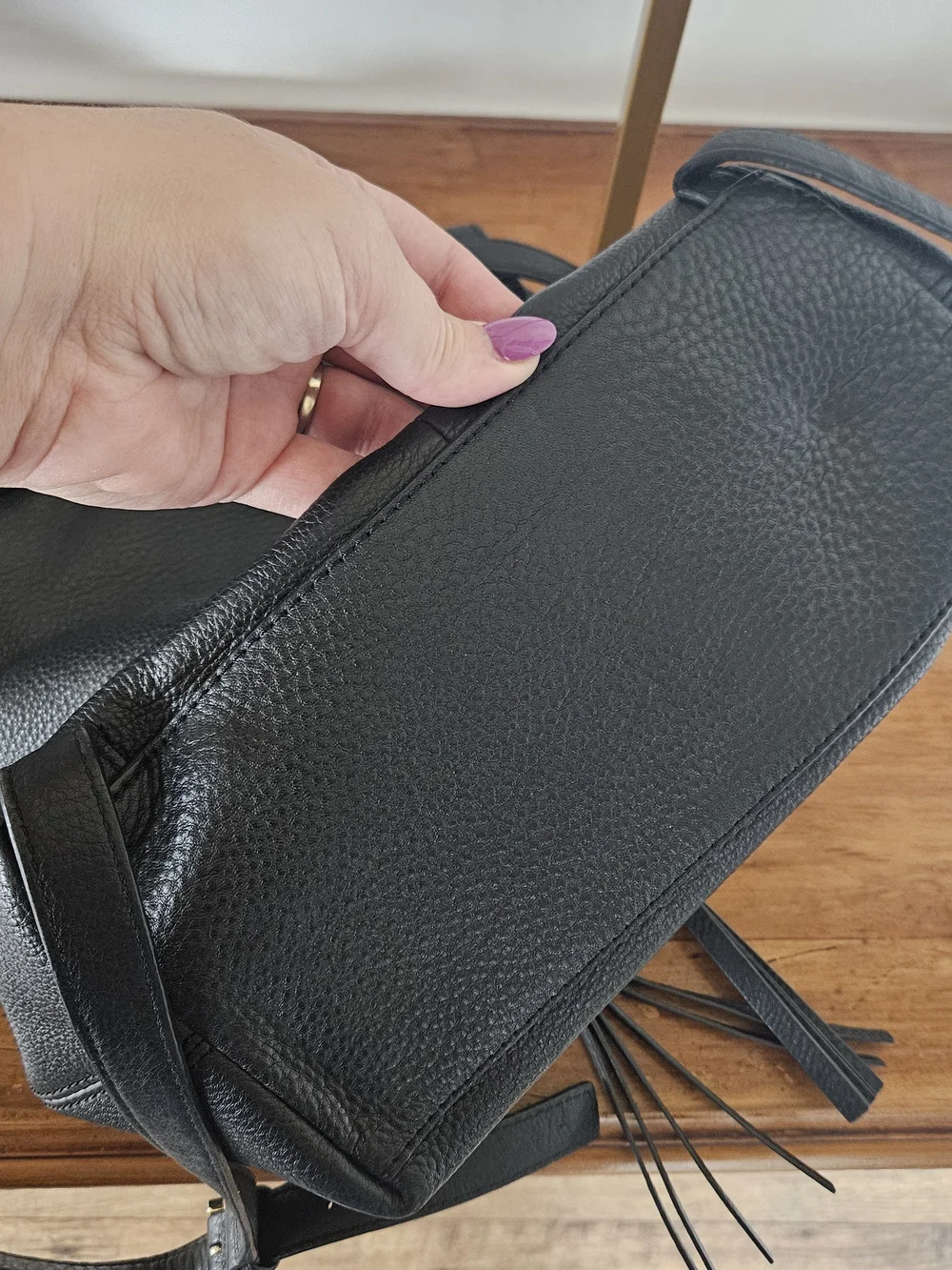 kate spade Black Pebbled Leather Backpack with Tassels